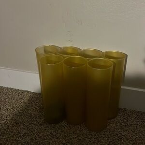 A set of 7 Gold vases